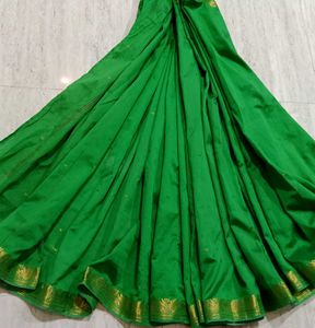 Elegant Green Saree with Golden Border