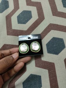 White Stud With Green And Golden Border