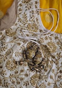 Yellow Border Saree With Golden Blouse