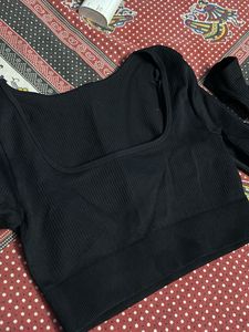 Black fitted long sleeve crop top with a thumbhole