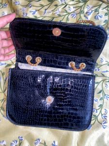 A Black Slingbag For Women