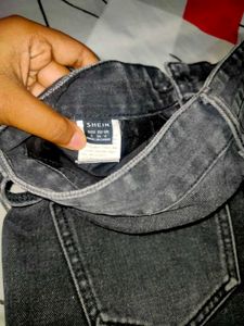 black faded baggy jeans