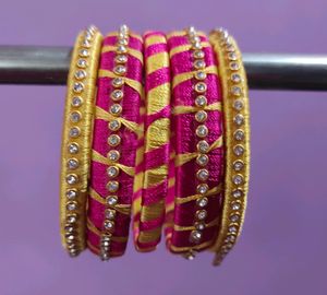 PINK AND GOLD COLOURED SILK THREAD BANGLES