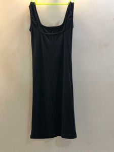 Black Sleeveless Bodycon With Buttons On It