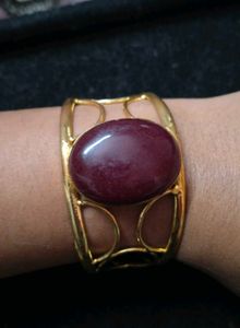 Gold Tone Cuff Bracelet with Maroon Stone