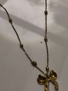 Gold Tone Bow Pendant Necklace