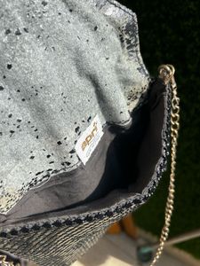 Black metal mesh sling bag