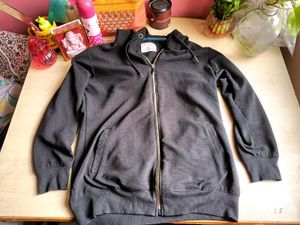 Black sweater with gold zip