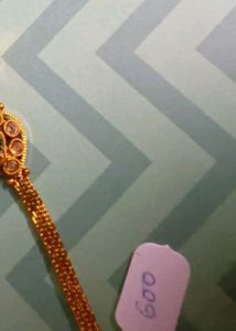 Gold Tone Bracelet with Red and Green Stones