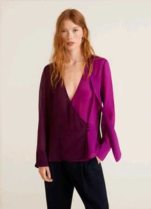 Branded two- tone wrap top.