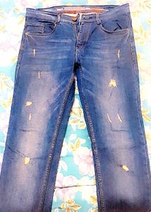 Distressed Blue Denim Jeans