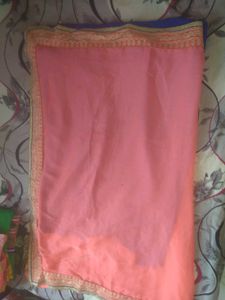 a new coral colour  chiffon saari without blouse