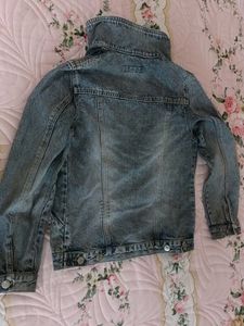 brand new slightly ripped denim jacket