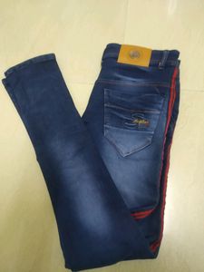 Blue Jeans With Two Red Stripes On Sides