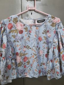 This is a Top From Sassafras . It Is Blue In Colour With Floral Print On It . Sixe Is XL