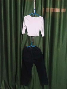 white top ripped straight jeans