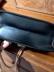 spacious black sling bag