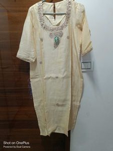 Beautiull cream kurti with neck work