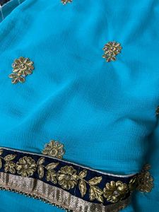 cyan color embroidery work saree