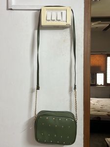 Party Wear Green Sling With Metal Chain Detail
