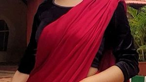HOT RED SATIN SAREE WITH BLACK VELVET BLOUSE .