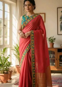 Elegant Coral Saree with Floral Border