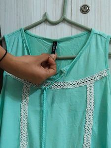 cyan sleeveless top 🩵
