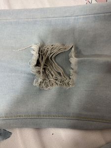 Distressed Light Wash Denim Jeans