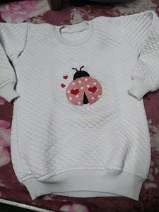White Sweatshirt With Patchwork.