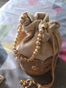 Elegant Gold Embellished Potli Bag