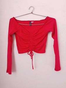 branded red long sleeves crop top.