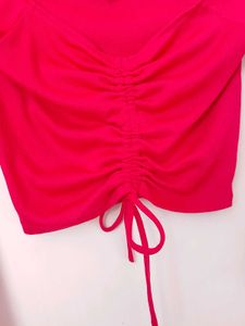 branded red long sleeves crop top.