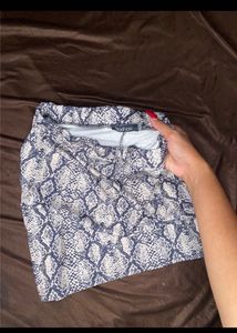 snakeskin print imported mini skirt