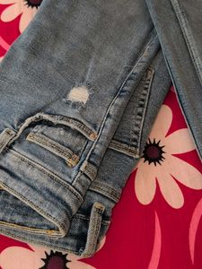 Distressed Light Wash Denim Jeans