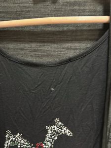 Breezy and effortlessly stylish, this black top wi