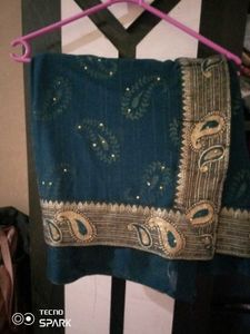 Elegant Teal Saree with Paisley Border