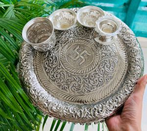 Karva chauth Pooja thali German and silver antique thali mor info inbox me**item code: Swastik pooja thali set**Thali size:Diameter 11”2 katoris1 kalash loti1 deepam
