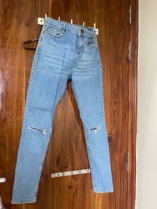 Ripped Knee Light Wash Jeans
