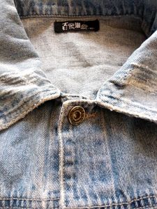 Distressed Blue Denim Jacket With A Touch Of 90s