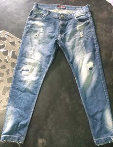 Distressed Blue Denim Jeans