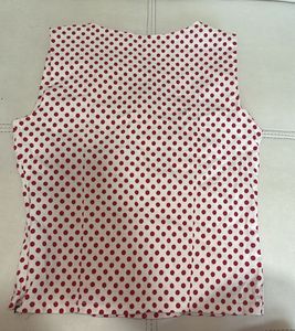 white top with red polka dots
