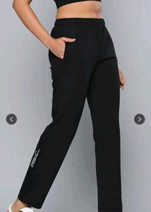 black solid knitted track pants with 2 pockets.