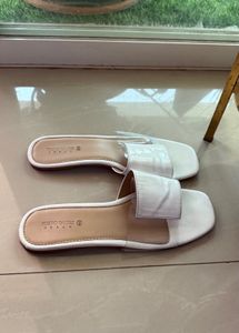 Elegant White Slip-On Sandals by Tokyo Talkies