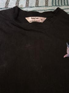 Unique black graphic tee with eye-catching detail