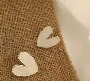 women white heart earrings