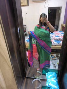 Green saree with multicolour details and glitter s