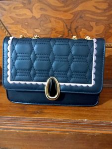 spacious black sling bag
