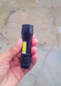 USB rechargeable XPE+COB LED flashlight.