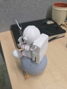 Astronaut Fishing on the Moon Figurine