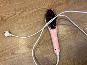 Woman’s hair straightener
